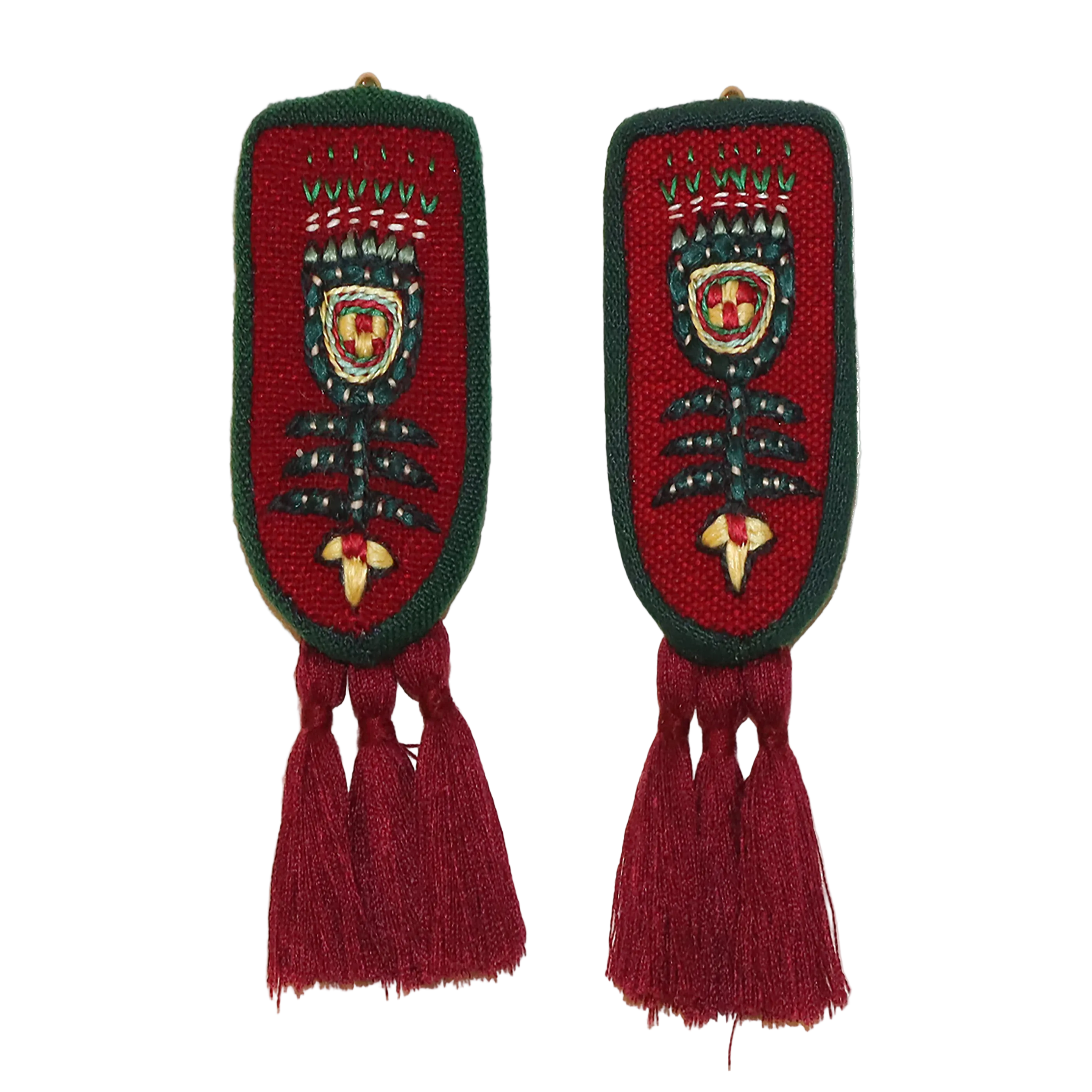 Pair of decorative earrings with red and green patterns