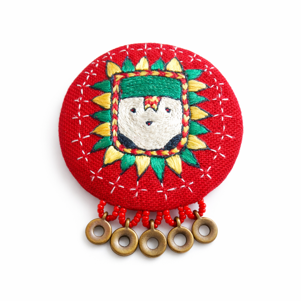 Sun guardian brooch